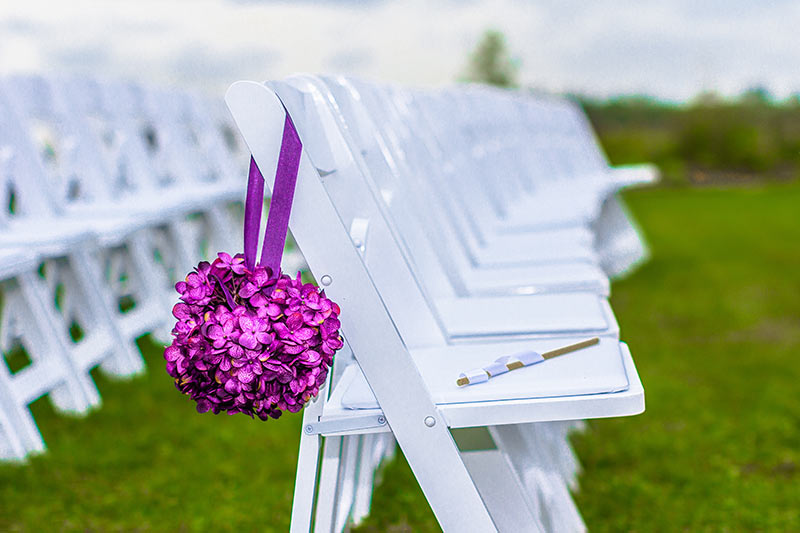 Chairs at outdoor wedding ceremony